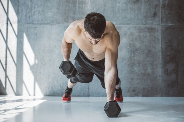 Man working out with Hex Dumbbells