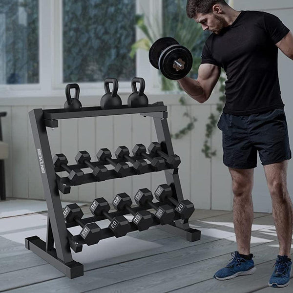 Man using dumbbells from a weight rack