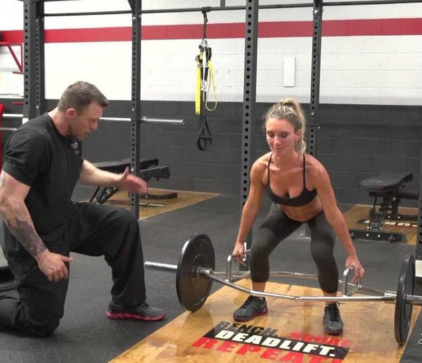 Woman using a Hex Bar in Weight Training