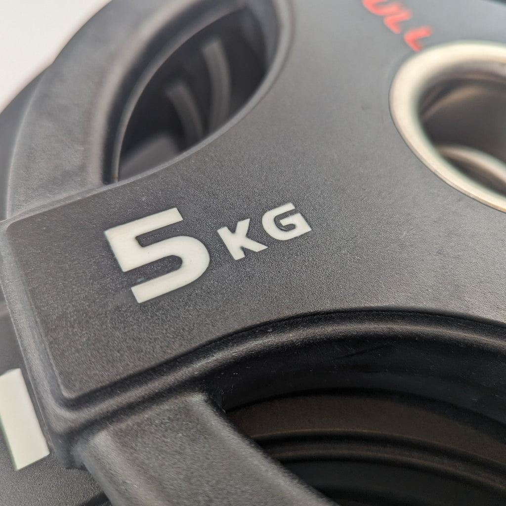 close up of 5kg quad grip plate