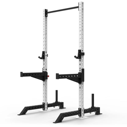 White commercial-grade freestanding squat rack with black spotter arms and black J-hooks on a white back route.